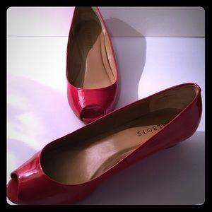 Classic shiny red patent leather peep toed pumps